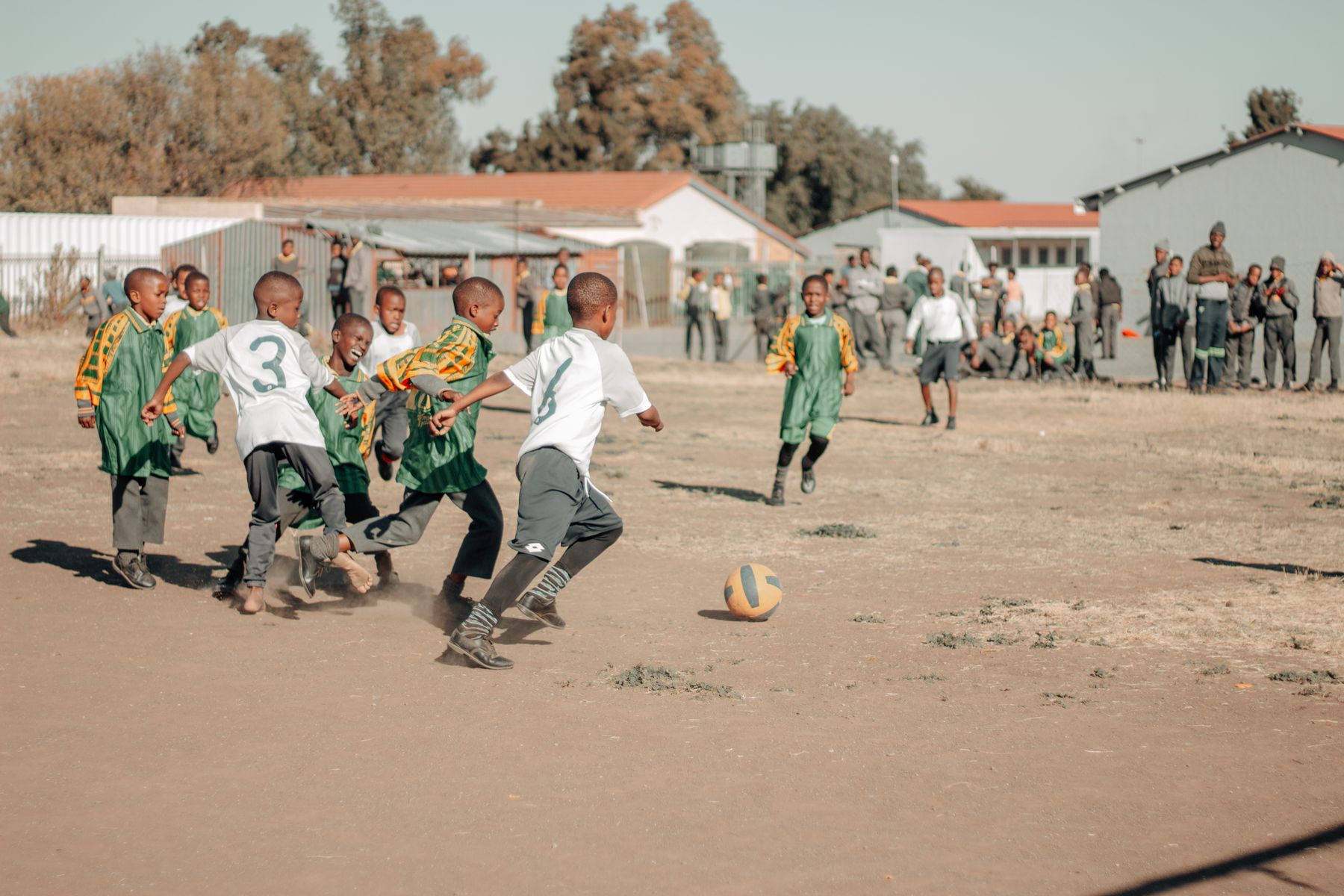 Illustrative children playing outdoors at a school playground, not the actual school or pupils